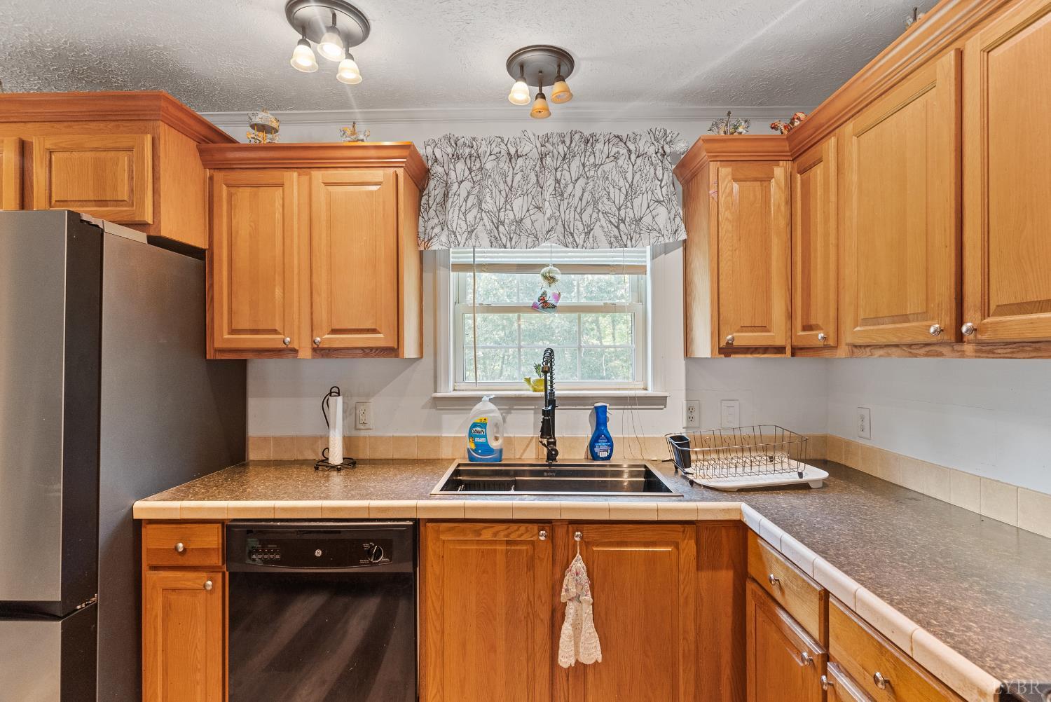 1720 Gallows Road Gretna, VA 24557 - Photo 13 of 73 a kitchen with stainless steel appliances granite countertop a sink a refrigerator and a granite counter tops