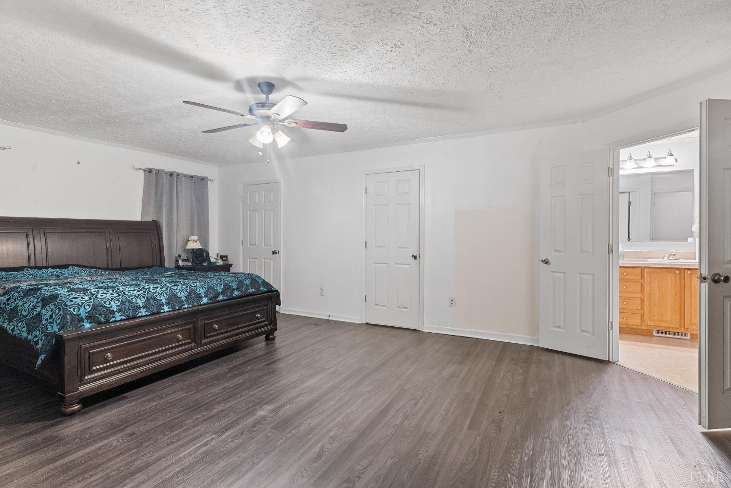 1720 Gallows Road Gretna, VA 24557 - Photo 16 of 73 a bedroom with a bed and wooden floor