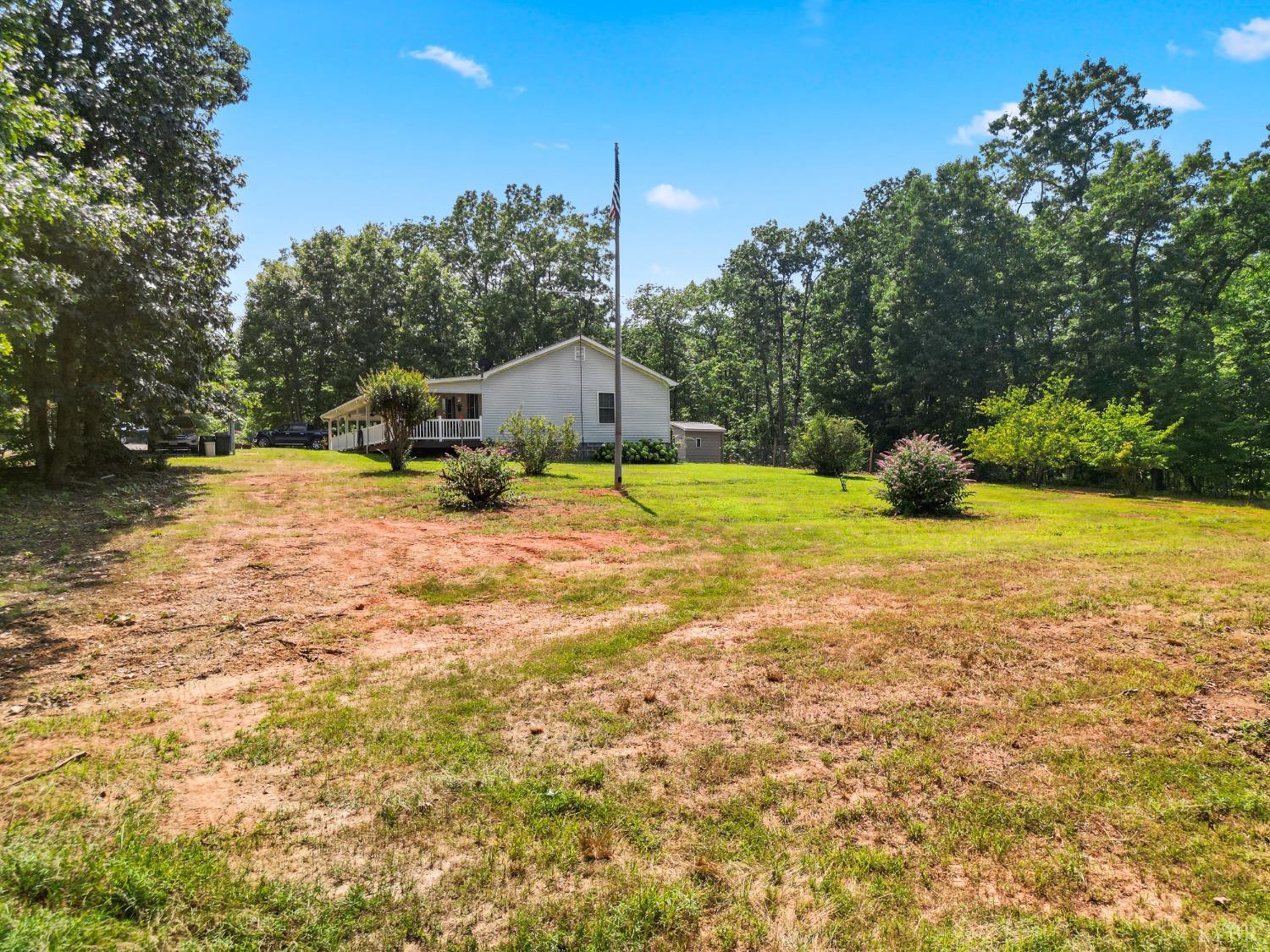 1720 Gallows Road Gretna, VA 24557 - Photo 36 of 73 a view of a house with a yard and garage