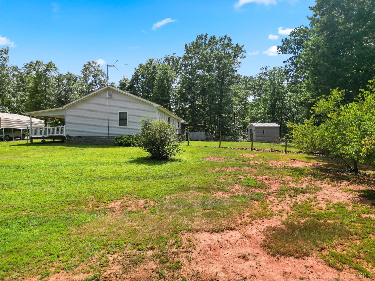 1720 Gallows Road Gretna, VA 24557 - Photo 37 of 73 a backyard of a house with table and chairs