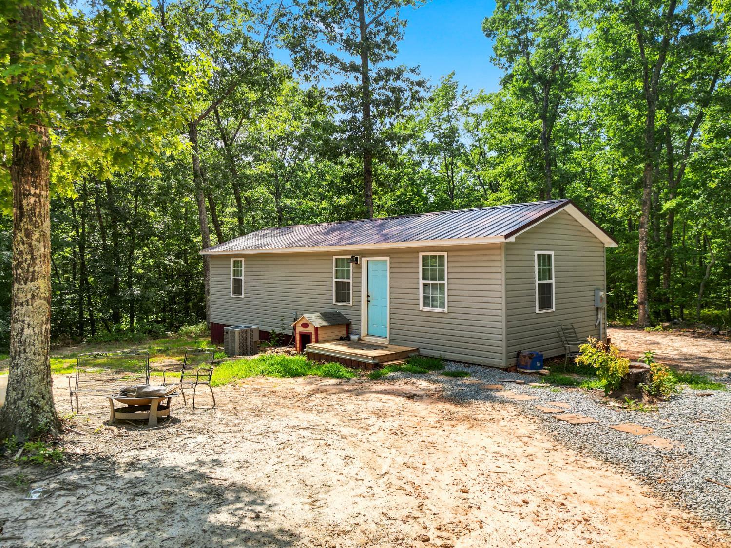 1720 Gallows Road Gretna, VA 24557 - Photo 44 of 73 a backyard of a house with yard table and chairs