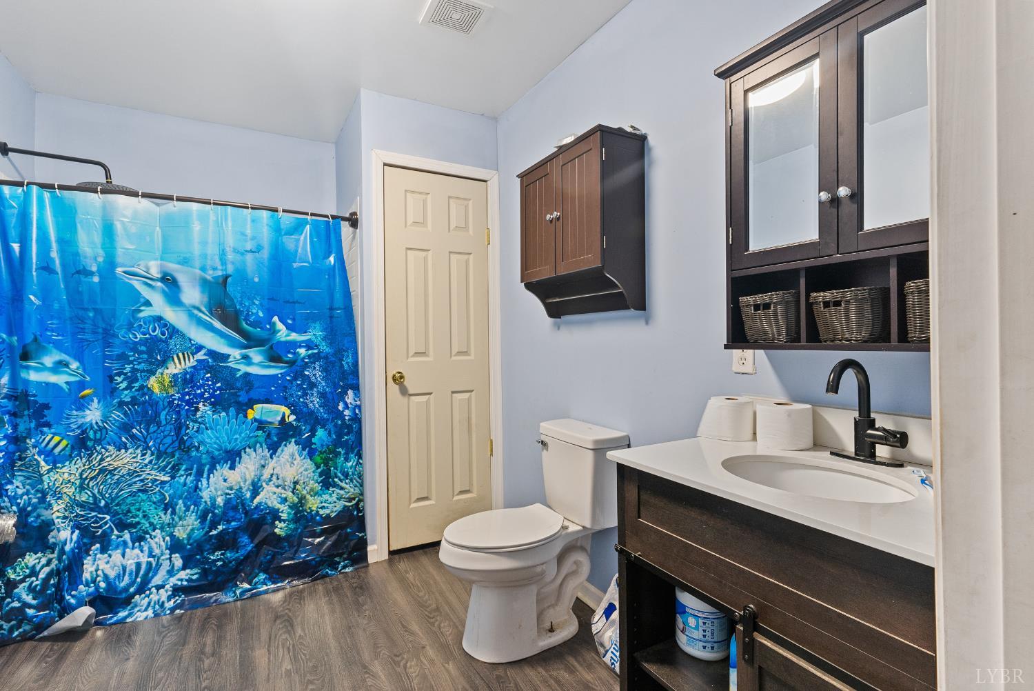 1720 Gallows Road Gretna, VA 24557 - Photo 56 of 73 a bathroom with a toilet sink and mirror