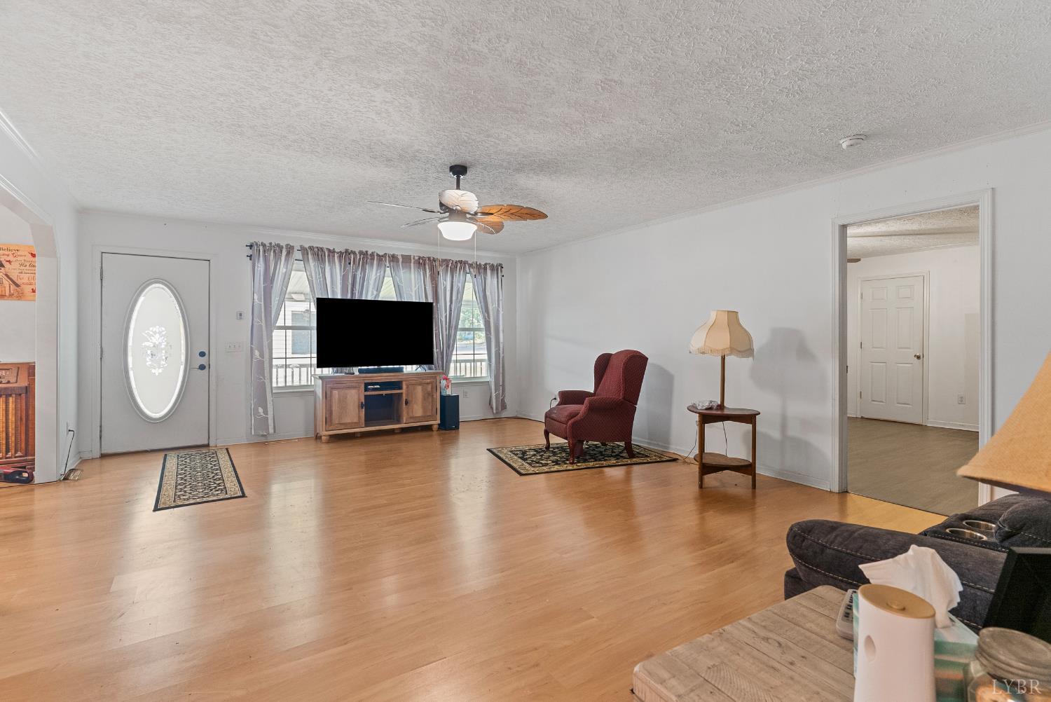 1720 Gallows Road Gretna, VA 24557 - Photo 6 of 73 a living room with furniture and a flat screen tv