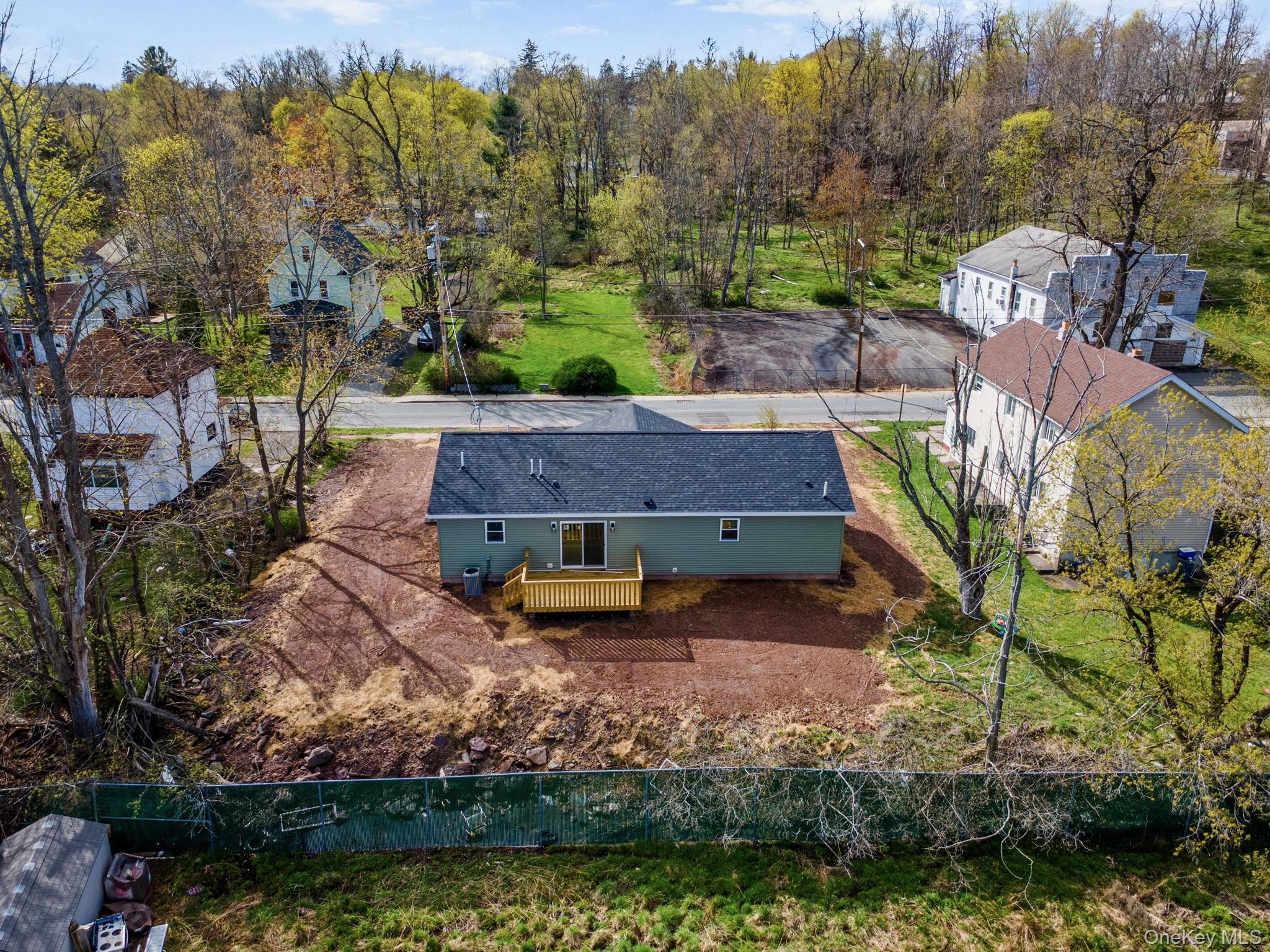 23 Spring Street Monticello, NY 12701 - Photo 34 of 44 an aerial view of a house with a yard basket ball court and outdoor seating