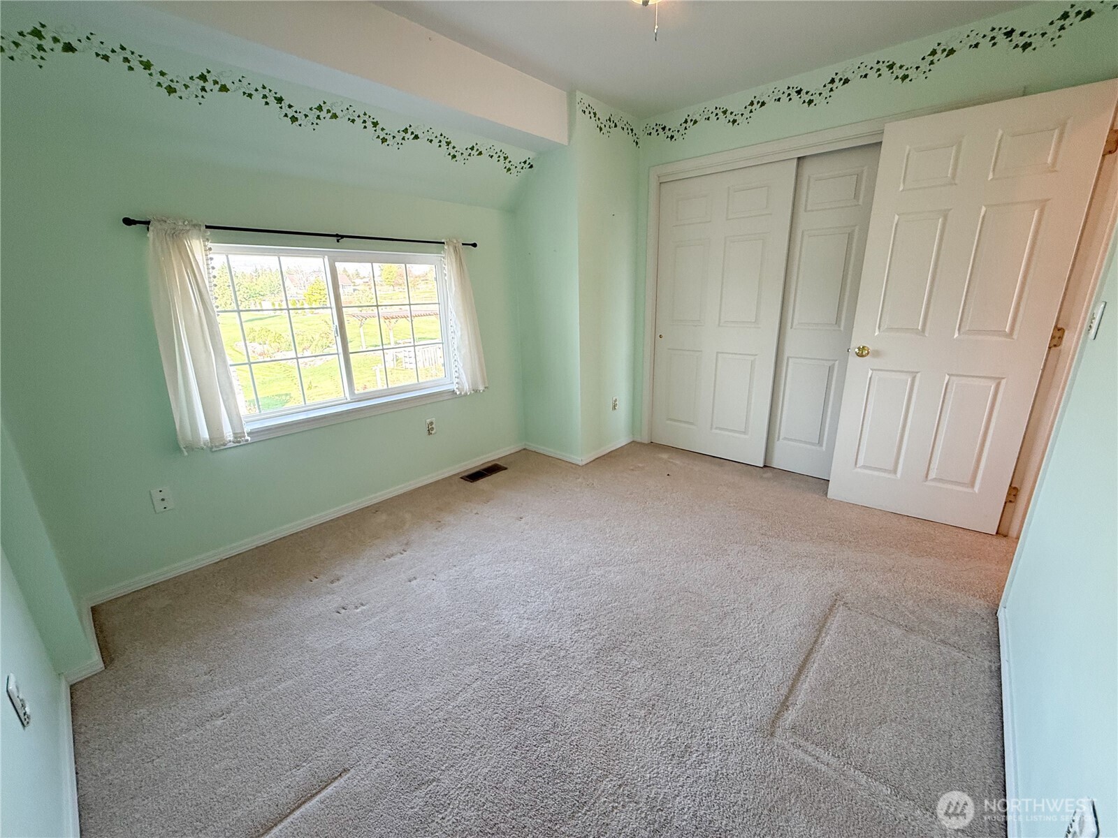 334 Omak River Road Omak, WA 98841 - Photo 25 of 31 a view of an empty room with a window