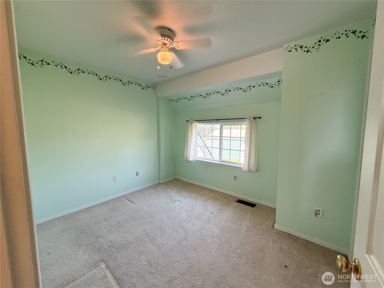 334 Omak River Road Omak, WA 98841 - Photo 26 of 31 a view of an empty room with a window