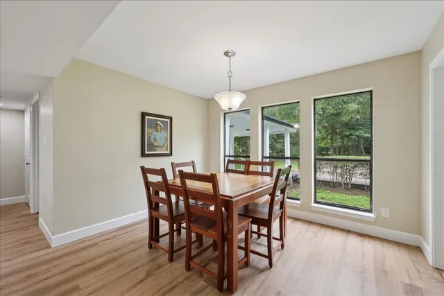 a dining room with furniture window wooden floor
