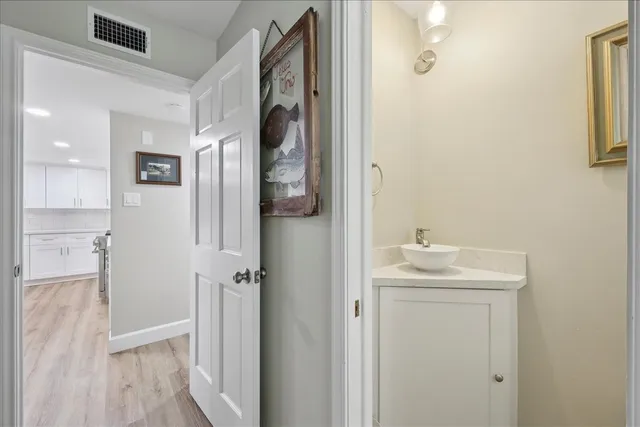 a bathroom with a sink and mirror