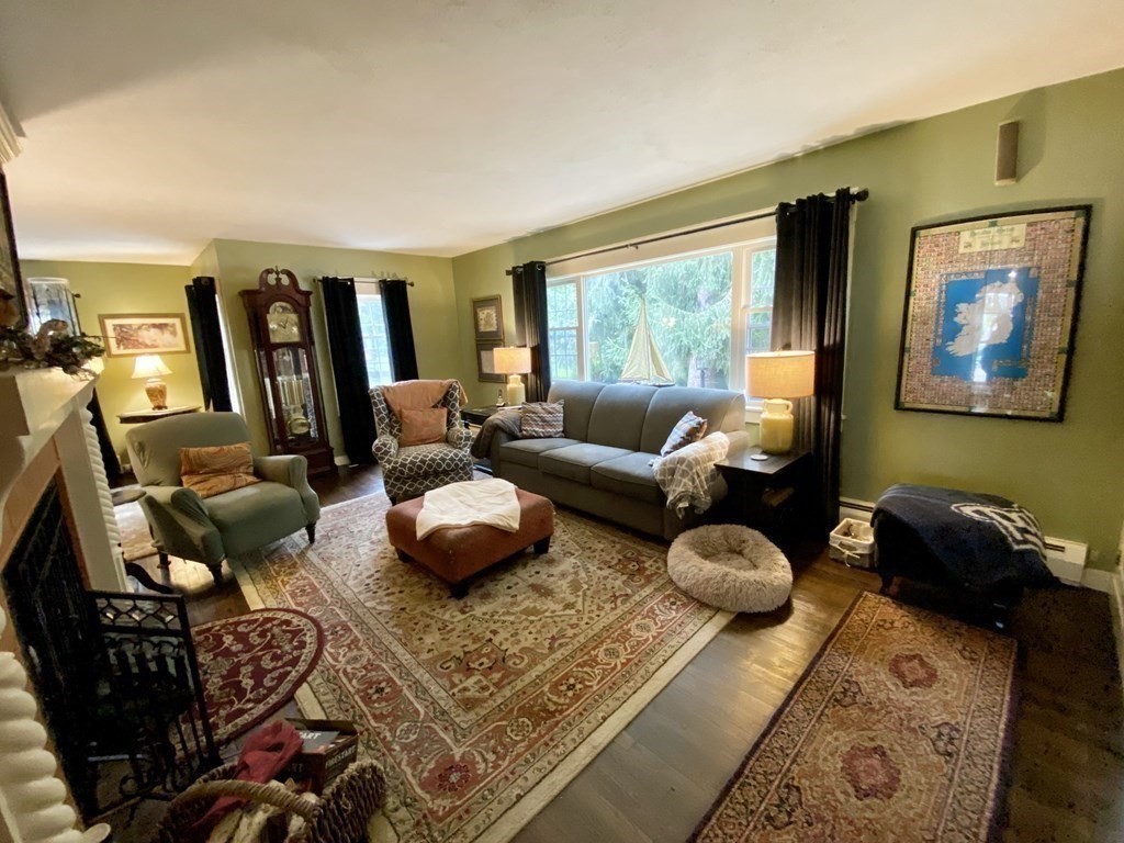 7 McGregory Road Sturbridge, MA 01566 - Photo 13 of 40 a living room with furniture and a window