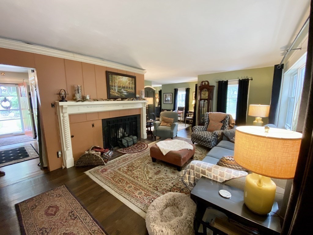 7 McGregory Road Sturbridge, MA 01566 - Photo 15 of 40 a living room with furniture and a fireplace