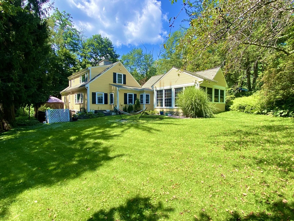 7 McGregory Road Sturbridge, MA 01566 - Photo 2 of 40 a front view of house with yard and green space
