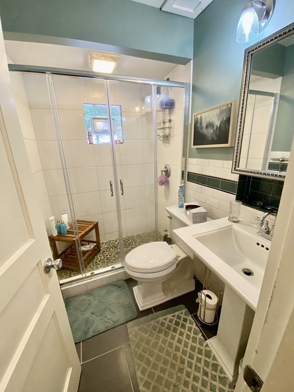 7 McGregory Road Sturbridge, MA 01566 - Photo 23 of 40 a bathroom with a sink toilet and shower