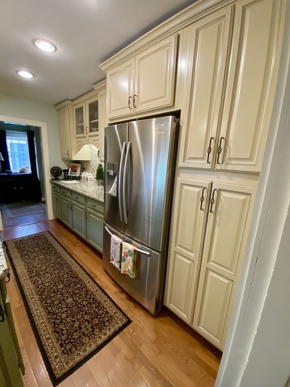7 McGregory Road Sturbridge, MA 01566 - Photo 9 of 40 a kitchen with stainless steel appliances granite countertop a refrigerator stove and sink
