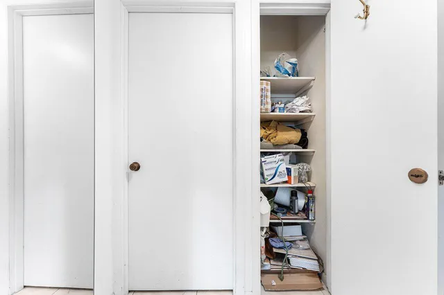 a view of front door with wooden floor