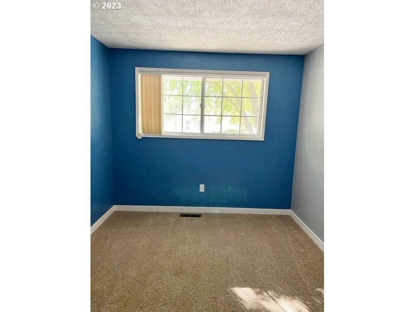 3331 Southwest Kirk Avenue Pendleton, OR 97801 - Photo 12 of 25 a view of an empty room with a window