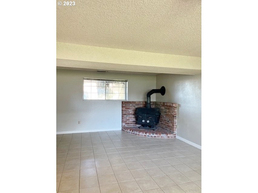 3331 Southwest Kirk Avenue Pendleton, OR 97801 - Photo 18 of 25 a living room with furniture and a fireplace