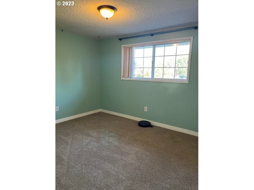 3331 Southwest Kirk Avenue Pendleton, OR 97801 - Photo 10 of 25 a view of an empty room with a window