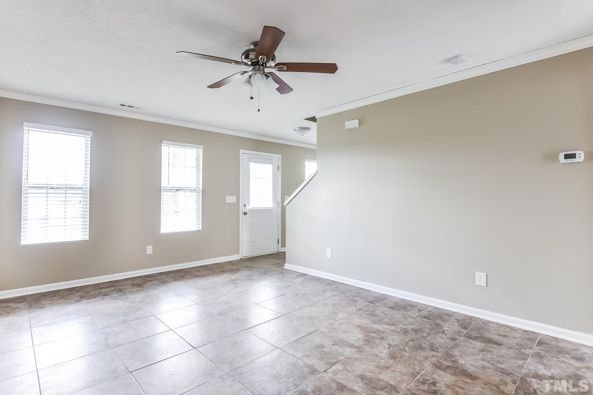 313 Pebble Way Durham, NC 27703 - Photo 5 of 17 a view of an empty room with a window