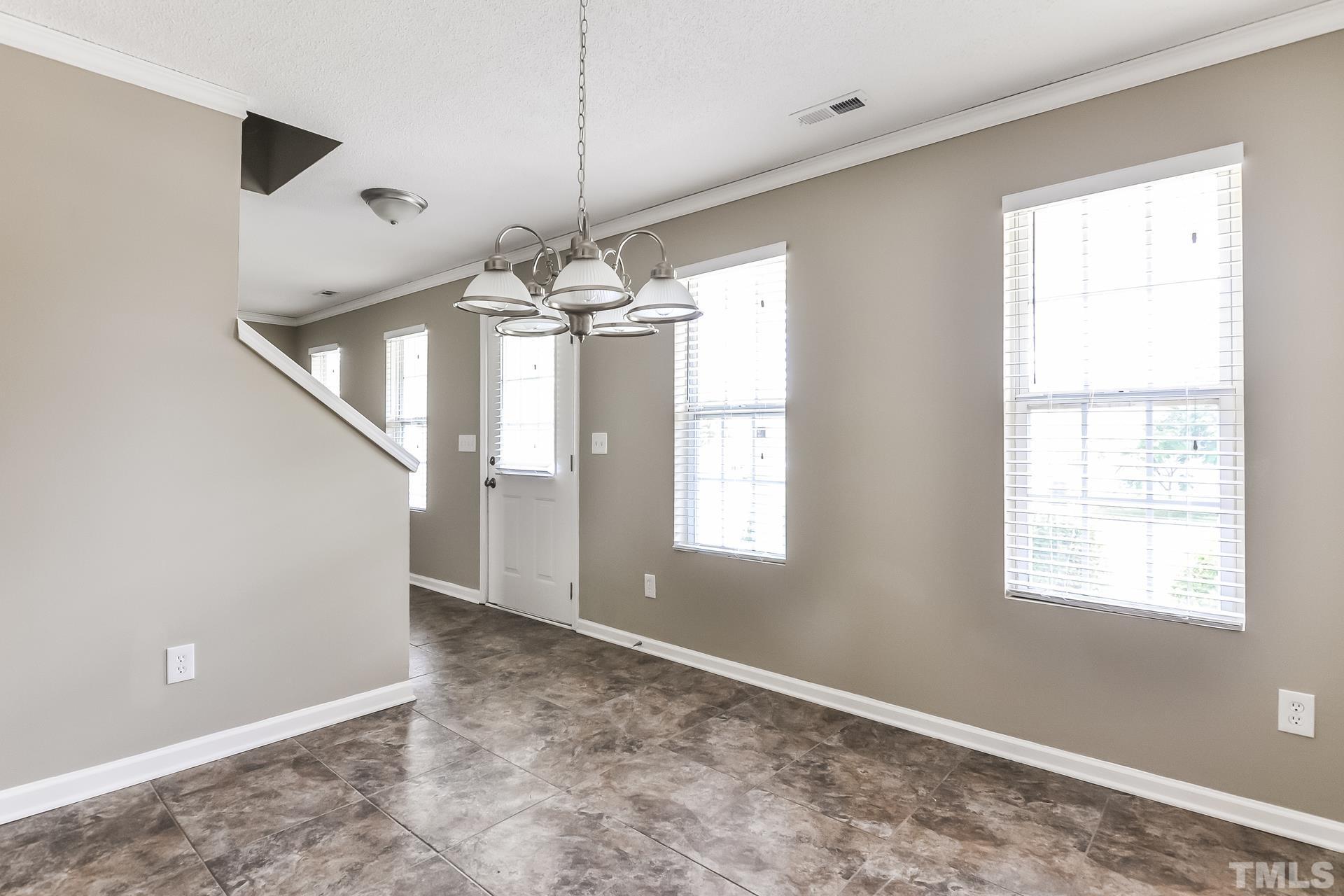 313 Pebble Way Durham, NC 27703 - Photo 6 of 17 a view of an empty room with a window