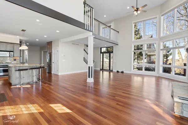 a view of a living room and kitchen with furniture wooden floor and a kitchen