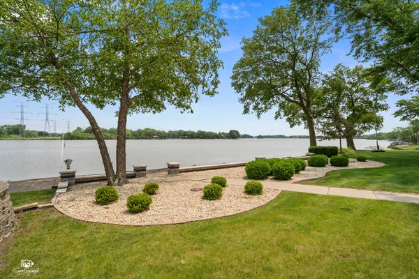 a view of a lake with a house in the background