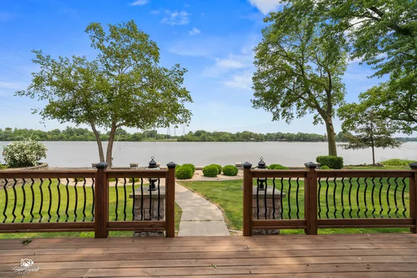 a view of wooden deck and lake