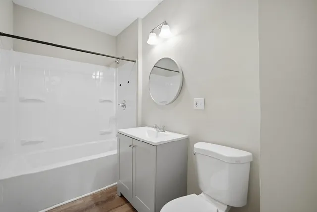 a bathroom with a toilet a sink and a bathtub