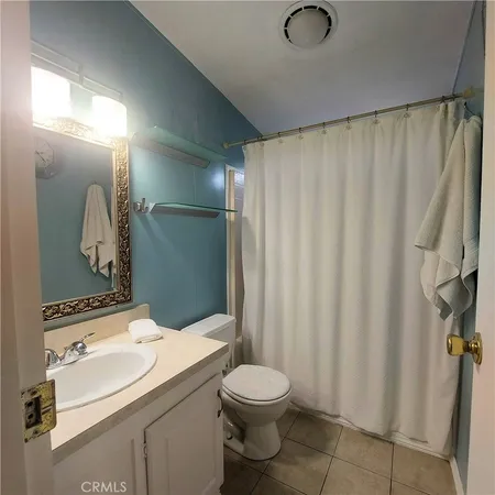 a view of a livingroom with an empty space and a window