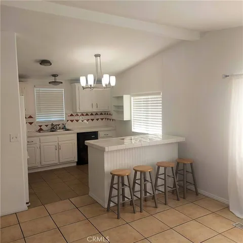 a bathroom with a sink vanity and a mirror