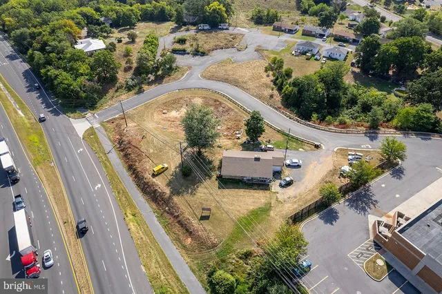 an aerial view of a house with a swimming pool
