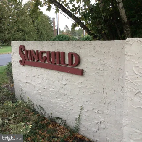 a view of a sign in front of house