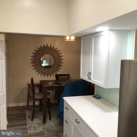 a kitchen with a table and chairs in it