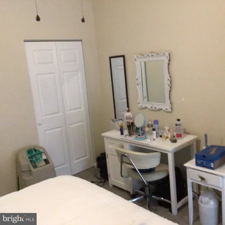 a bathroom with a sink a vanity and a mirror