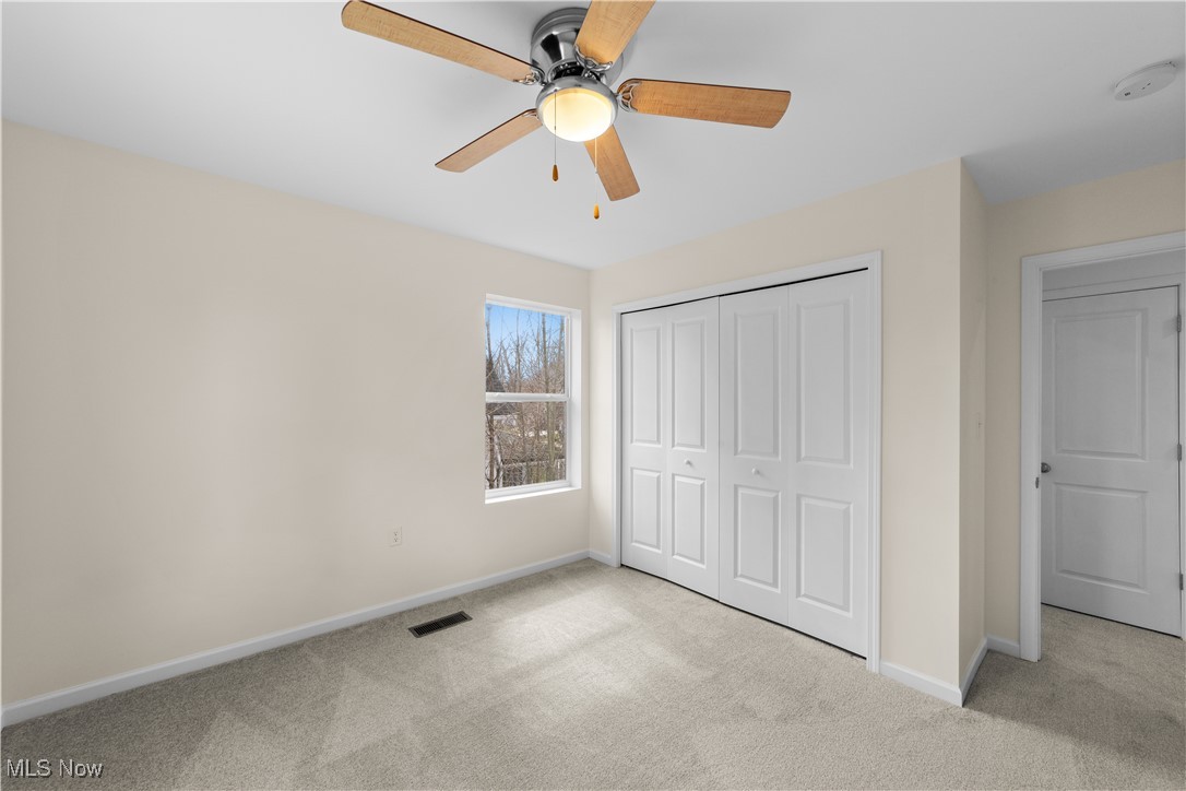 1527 Crest Road Cleveland Heights, OH 44121 - Photo 23 of 28 bedroom featuring light colored carpet, visible vents, a closet, and baseboards