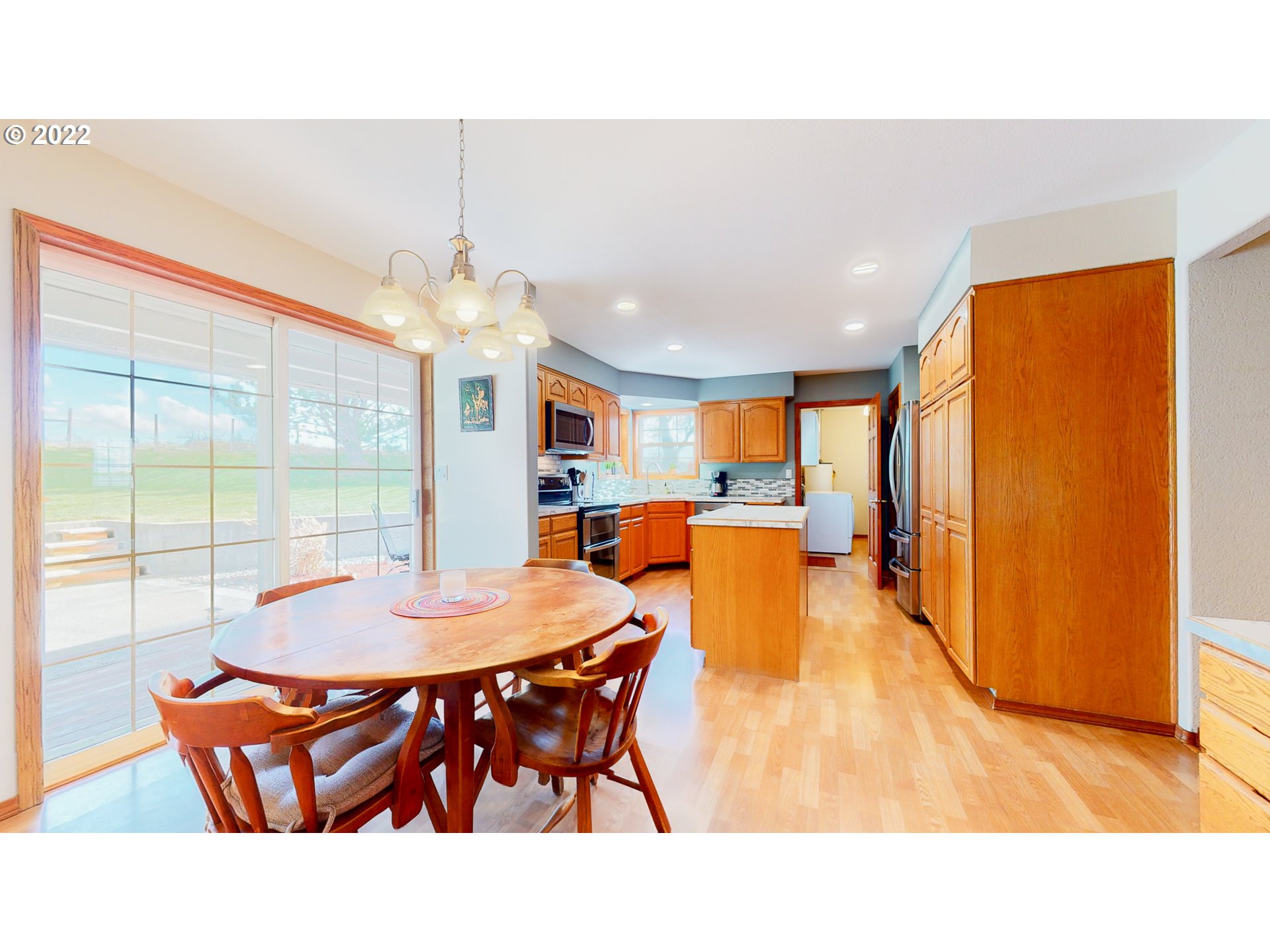 32902 Baxter Road Hermiston, OR 97838 - Photo 10 of 30 a open kitchen with a table and chairs