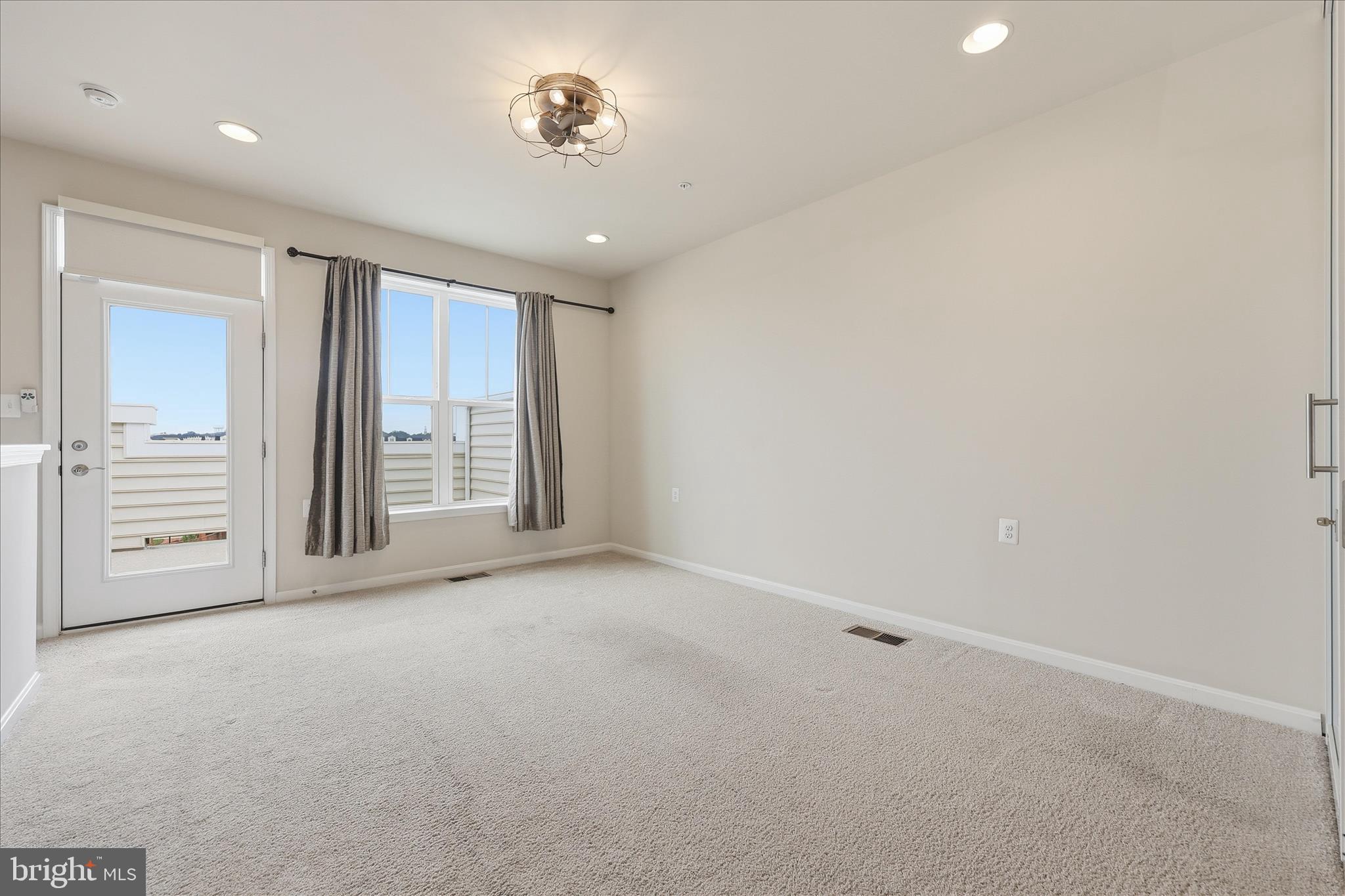1090 Holden Road Frederick, MD 21701 - Photo 28 of 60 an empty room with a empty space and windows