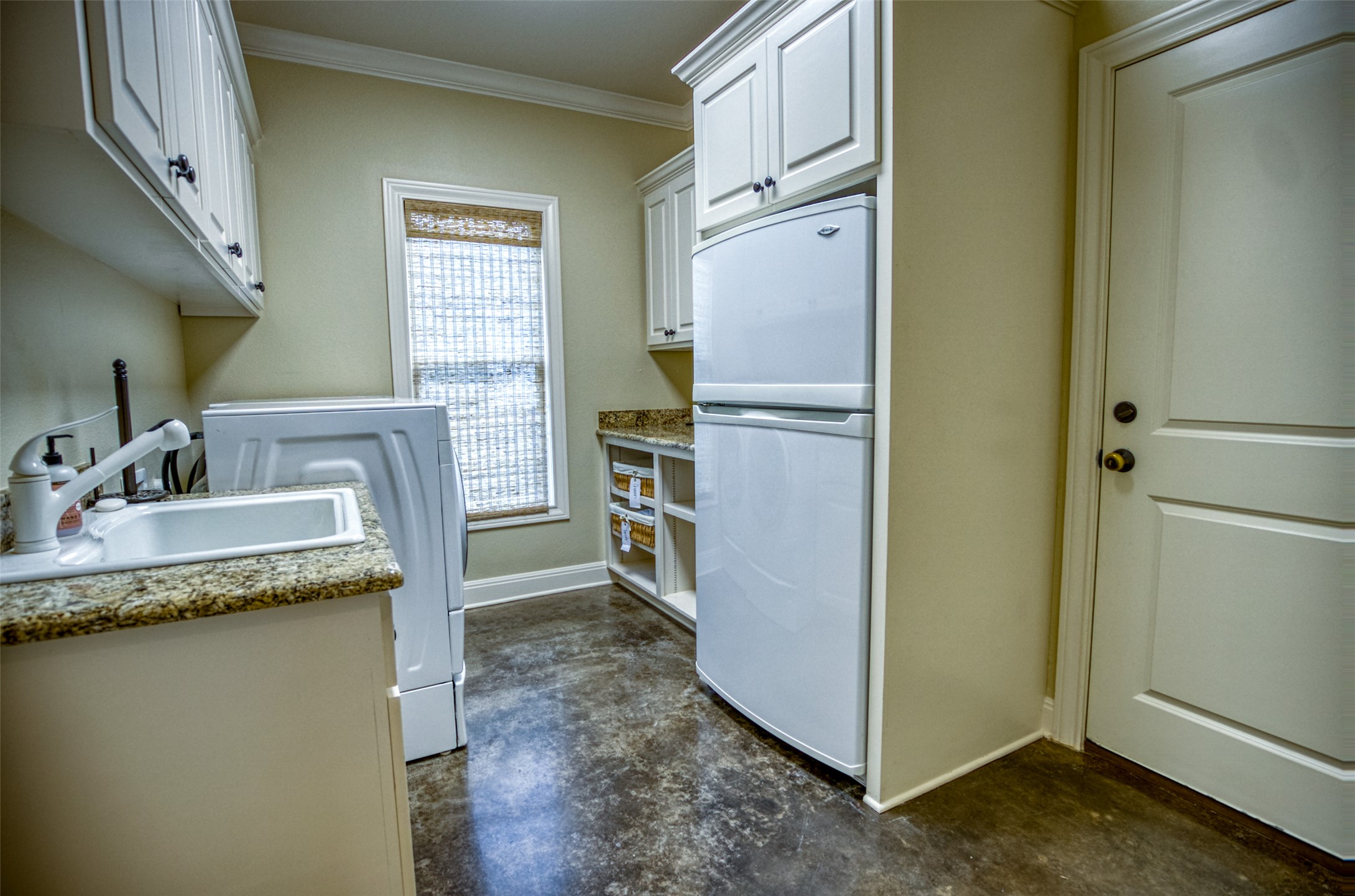 1035 Timber Elm Seguin, TX 78155 - Photo 14 of 35 Utility room includes washer, dryer, sink and fridge. Plenty of storage.