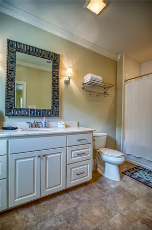 a bedroom with two beds and a table