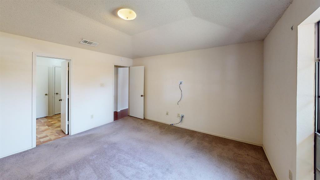 853 West Wintergreen Road Lancaster, TX 75134 - Photo 10 of 20 Carpeted flooring, white interior walls, and an overhead flush-mount light fixture