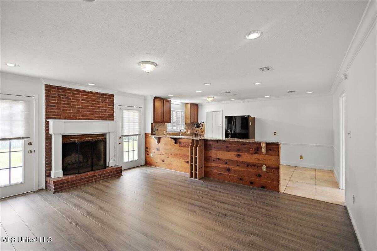 5807 South Pear Orchard Road Jackson, MS 39211 - Photo 10 of 26 10-HTP250816YY7GE-LivingRoomFacingKitche