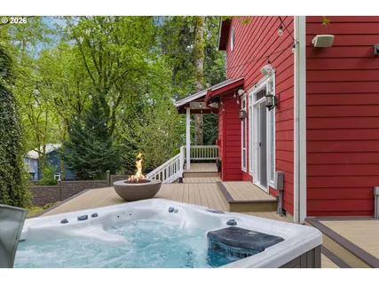 a backyard of a house with a garden and plants