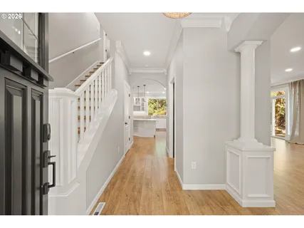 a view of an entryway with wooden floor