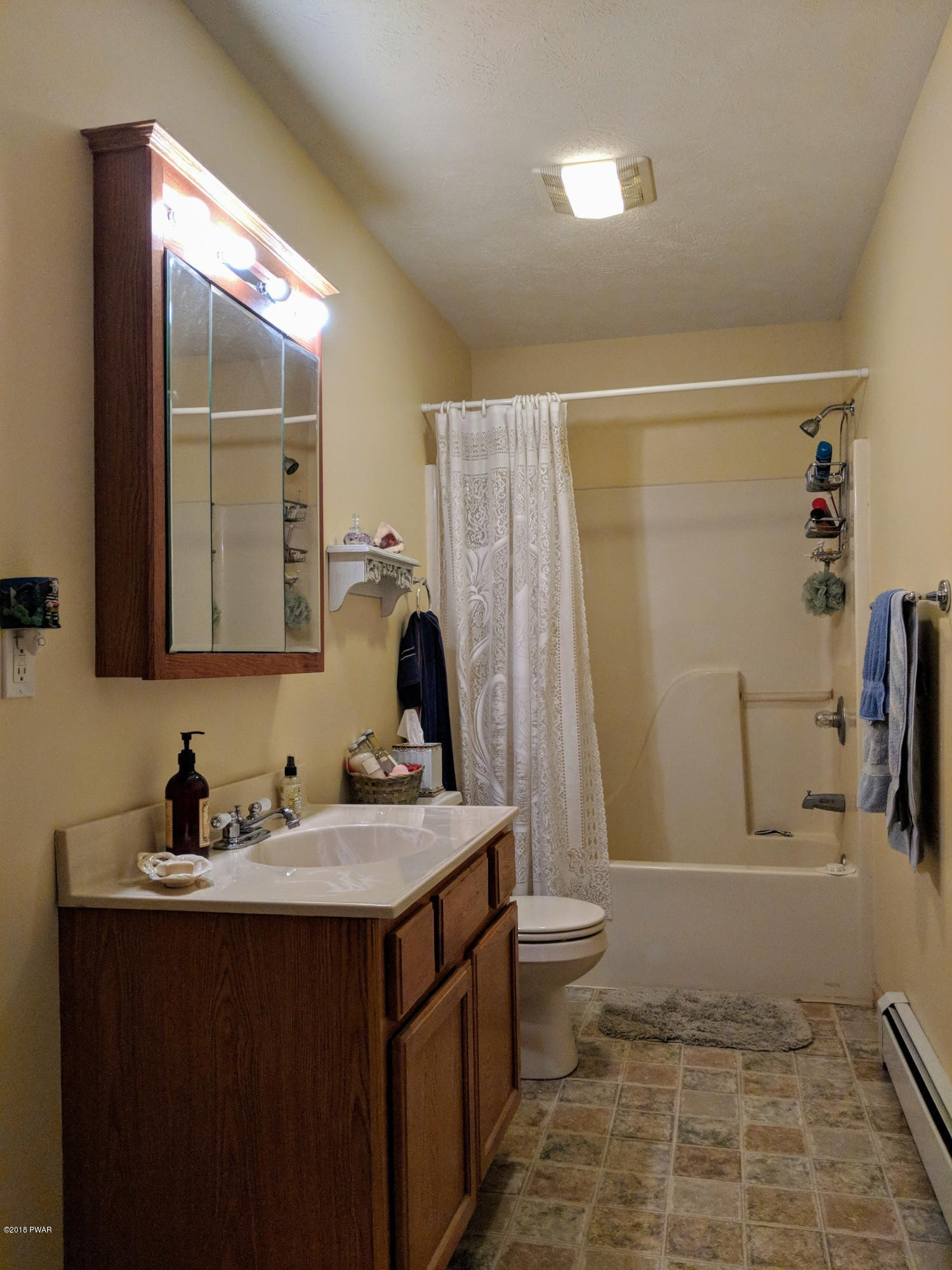 2653 Boulder Road Lake Ariel, PA 18436 - Photo 36 of 45 a bathroom with a sink toilet and shower