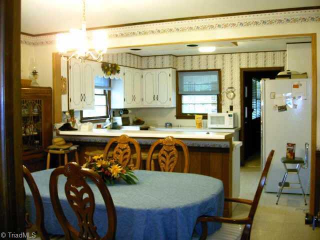 5364 Amick Road Julian, NC 27283 - Photo 3 of 9 Other. Dining room separates the kitchen with counter/bar