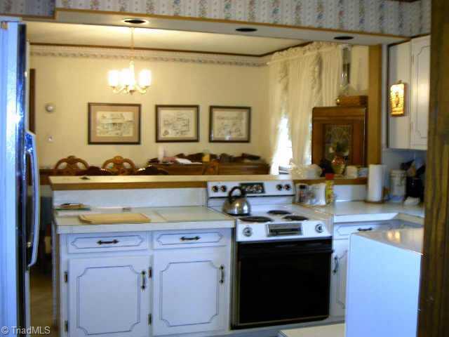 5364 Amick Road Julian, NC 27283 - Photo 4 of 9 Other. Open country kitchen with lots of cabinet and counter space