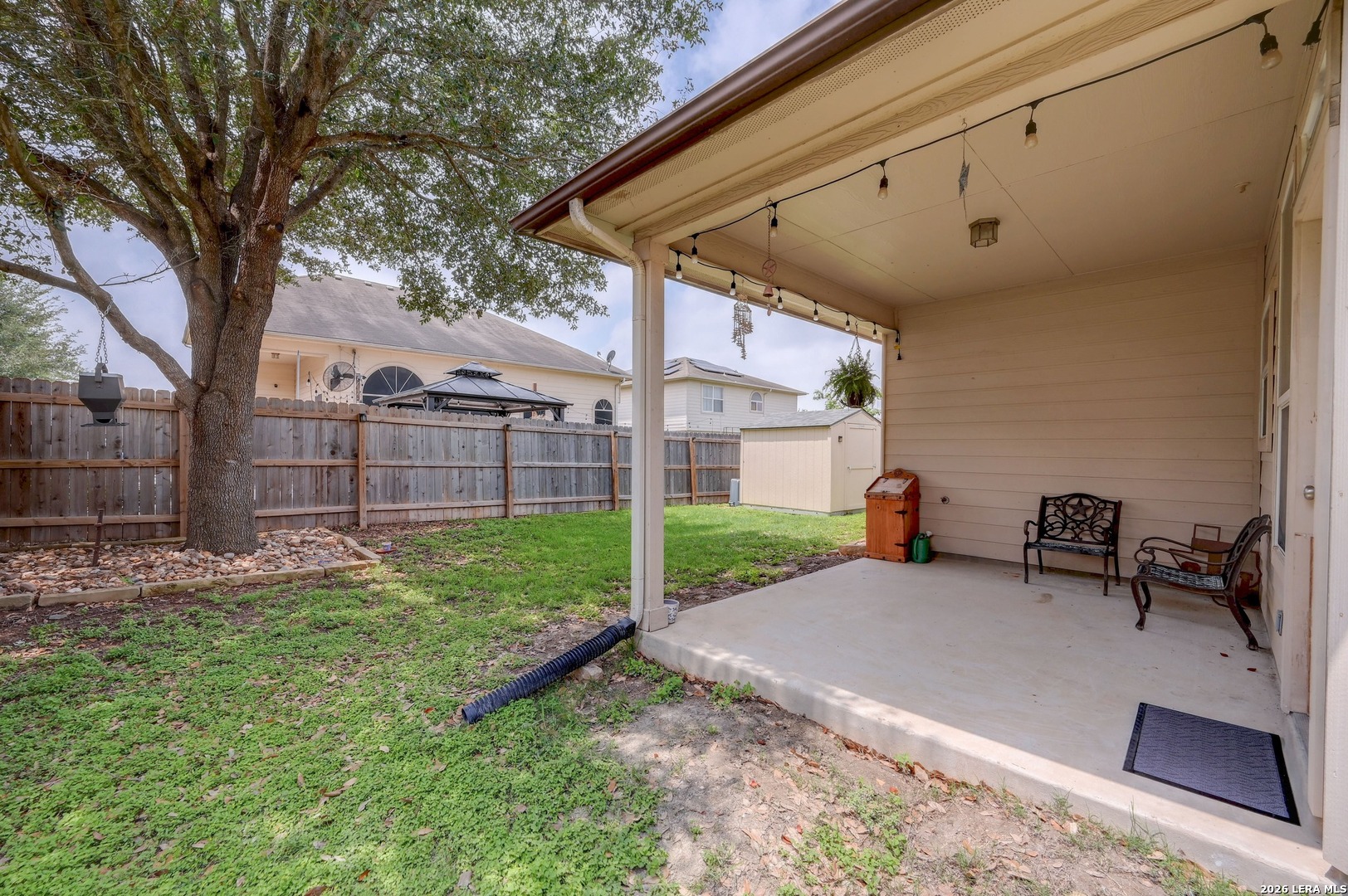 720 Hollow Ridge Schertz, TX 78108 - Photo 23 of 27 a view of a chair and table in backyard of the house