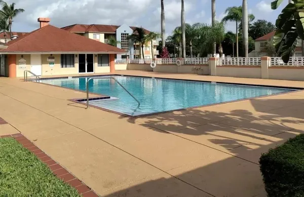 a view of a swimming pool with a patio