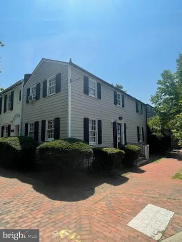a front view of a house with yard