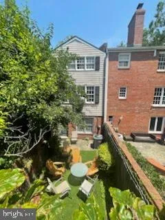 a house with swimming pool in front of it