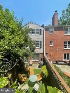a swimming pool with outdoor seating and yard